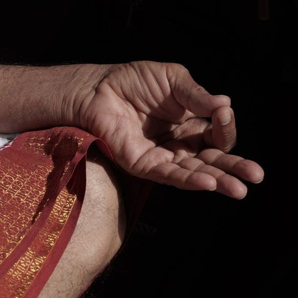 Close up of hands in a mudra during meditation session